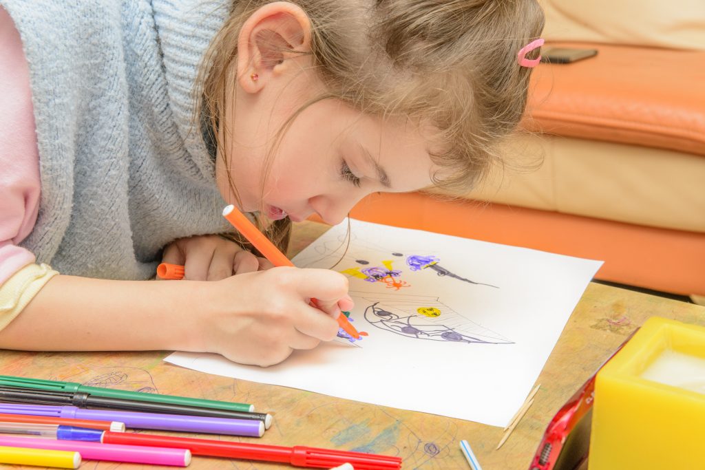 Little Girl with Markers